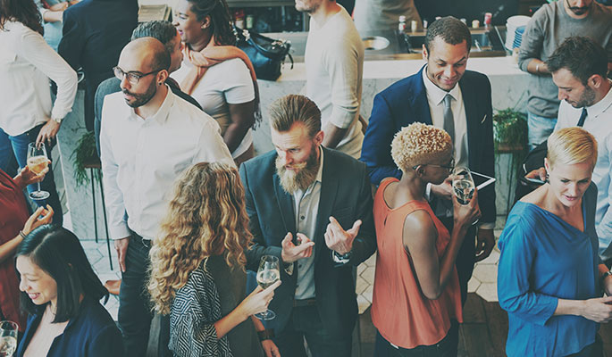 overhead view of people at a conference talking