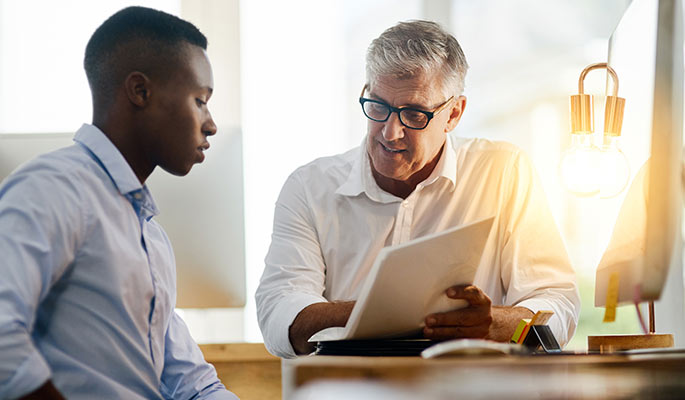 Diverse businessmen in a small team meeting