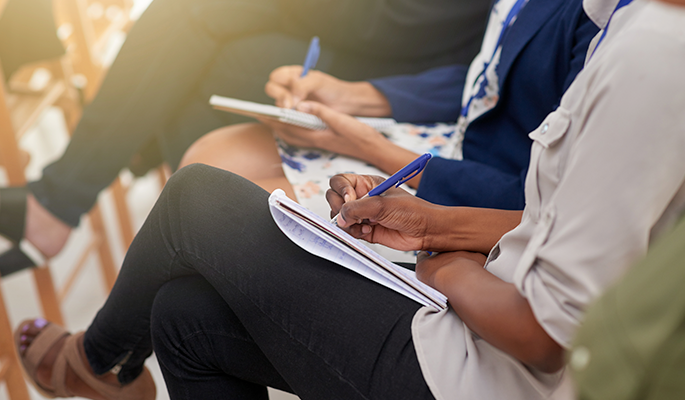 Notes are taken during a diversity and inclusion workshop tailored to the needs of a function-based group within the organization