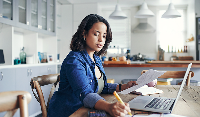 An employee takes a standalone self-paced eLearning course from their home workspace