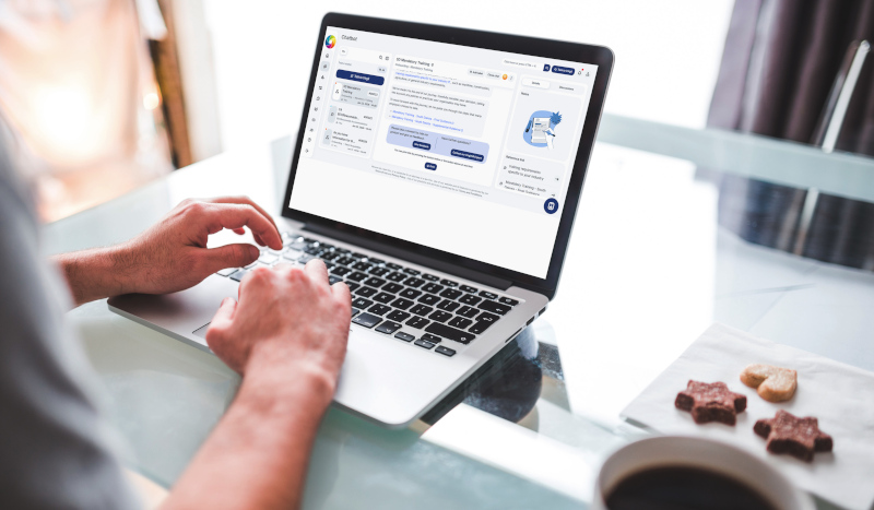 A photograph of a laptop showing the chatbot functionality within employment law navigator