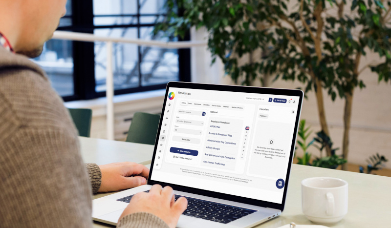 A photograph of a laptop showing the resources functionality within employment law navigator